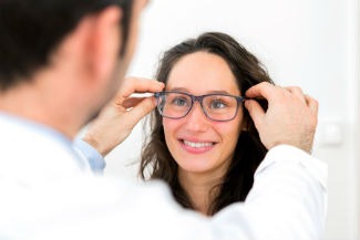 Woman trying on glasses