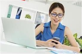 Woman with glasses on her phone