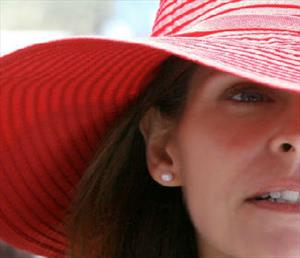 woman with a big red floppy hat
